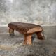 Small stool, footrest in blond teak, organic monoxyle with cut corners.