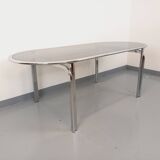 Vintage oval dining table in smoked glass and chrome metal, Space Age style.