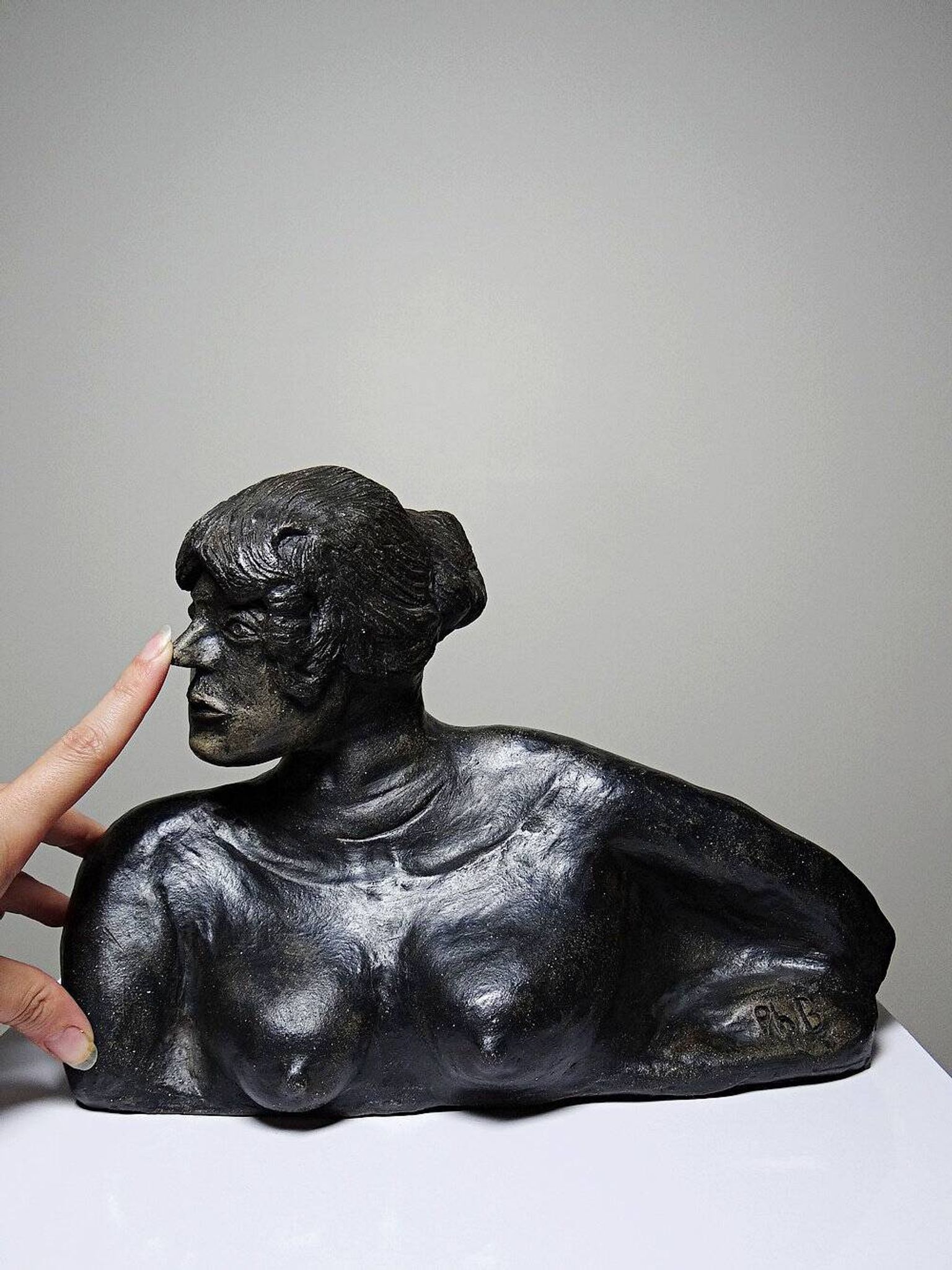 20th-century ceramic bust of a woman, an unidentified piece of art.