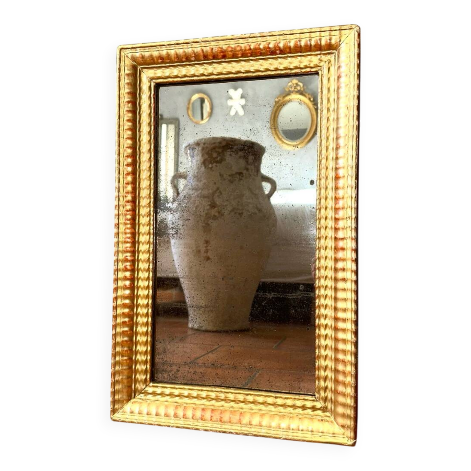 Antique gilded mirror from the Directoire period, 19th century.