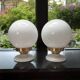 Pair of wall sconces with white opaline globes