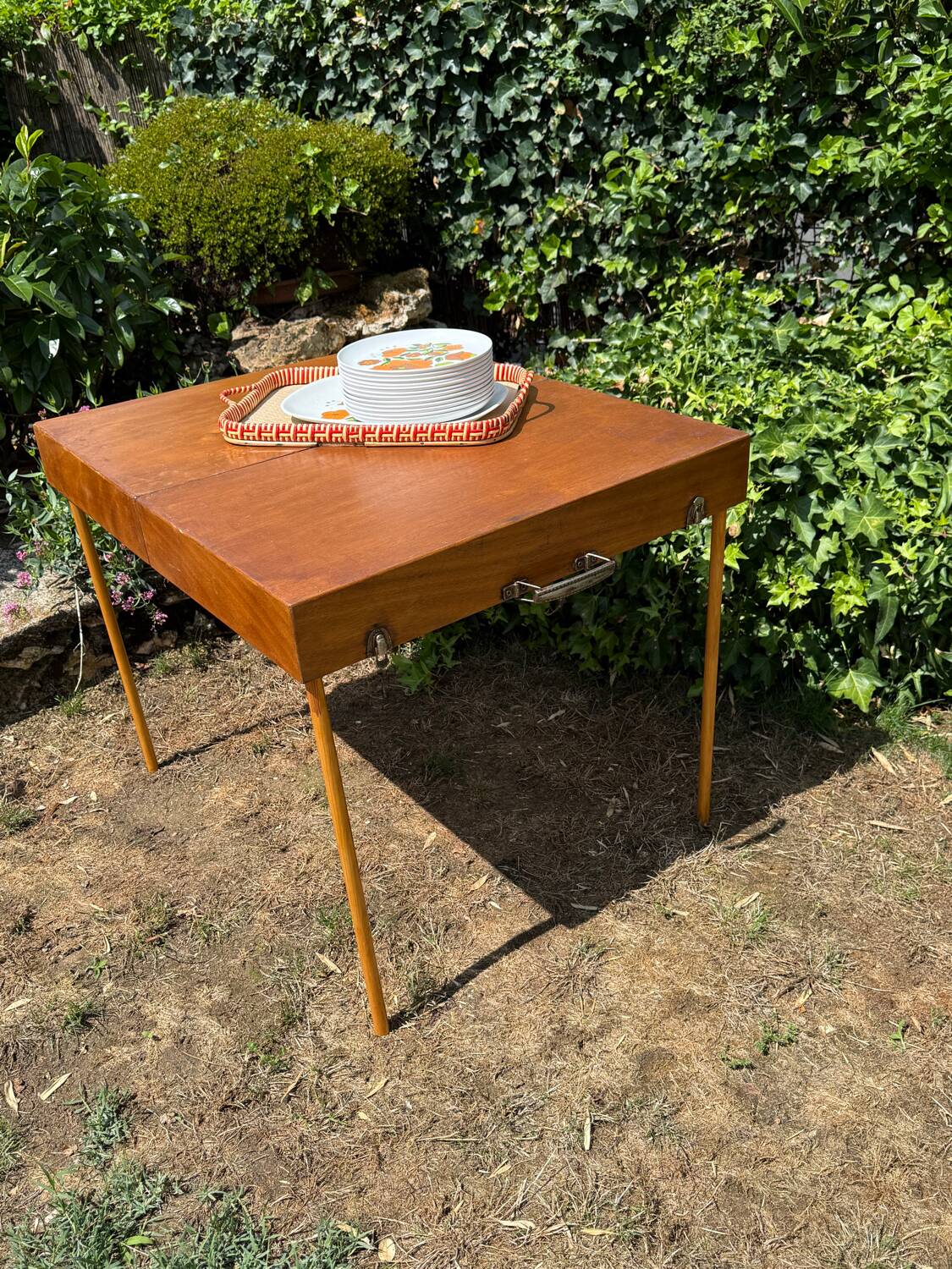 Folding picnic table, vintage suitcase 1950.