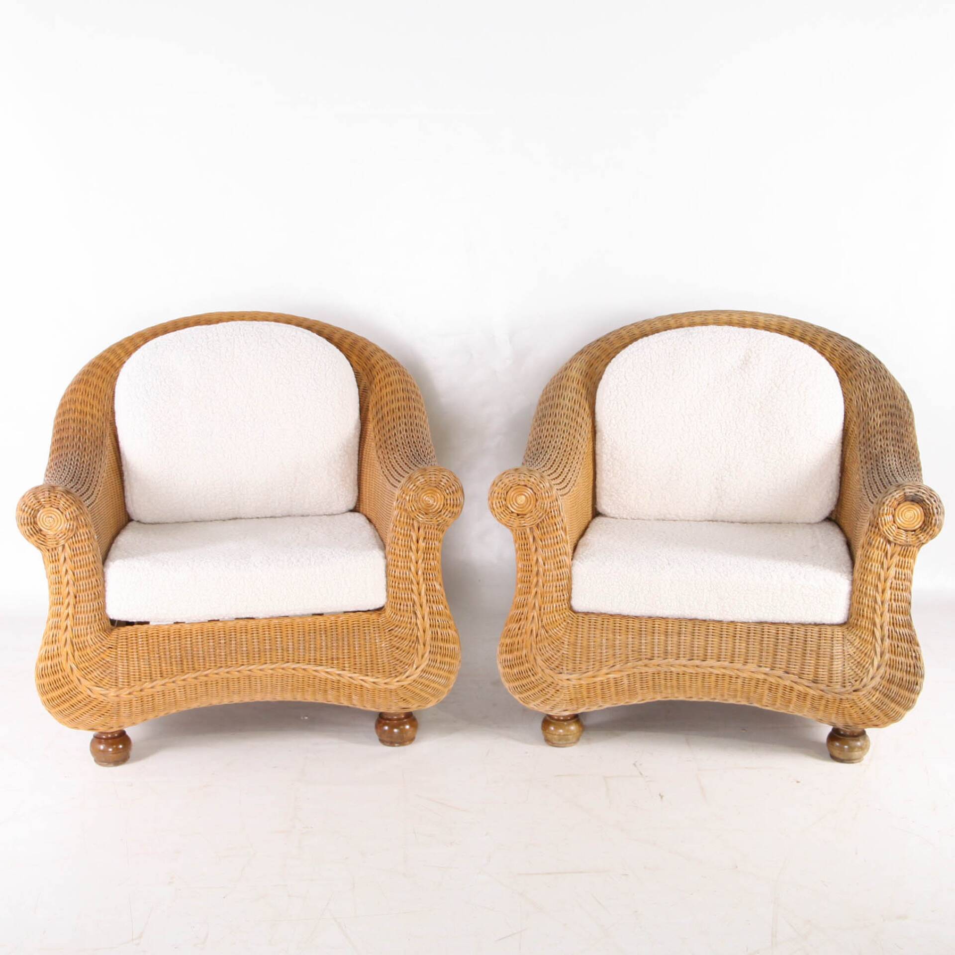 Pair of woven wicker armchairs