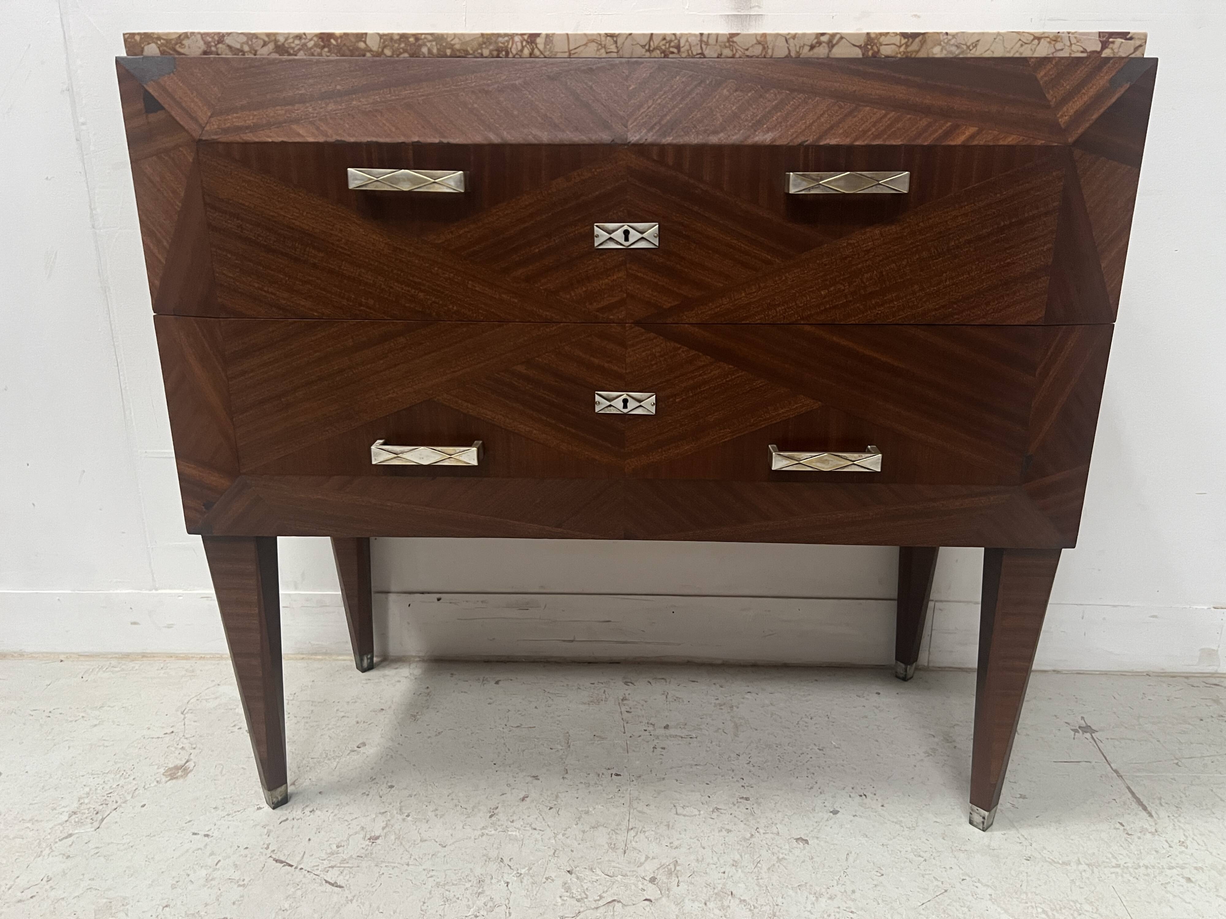 Art Deco chest of drawers with cut sides in mahogany veneer, 20th century