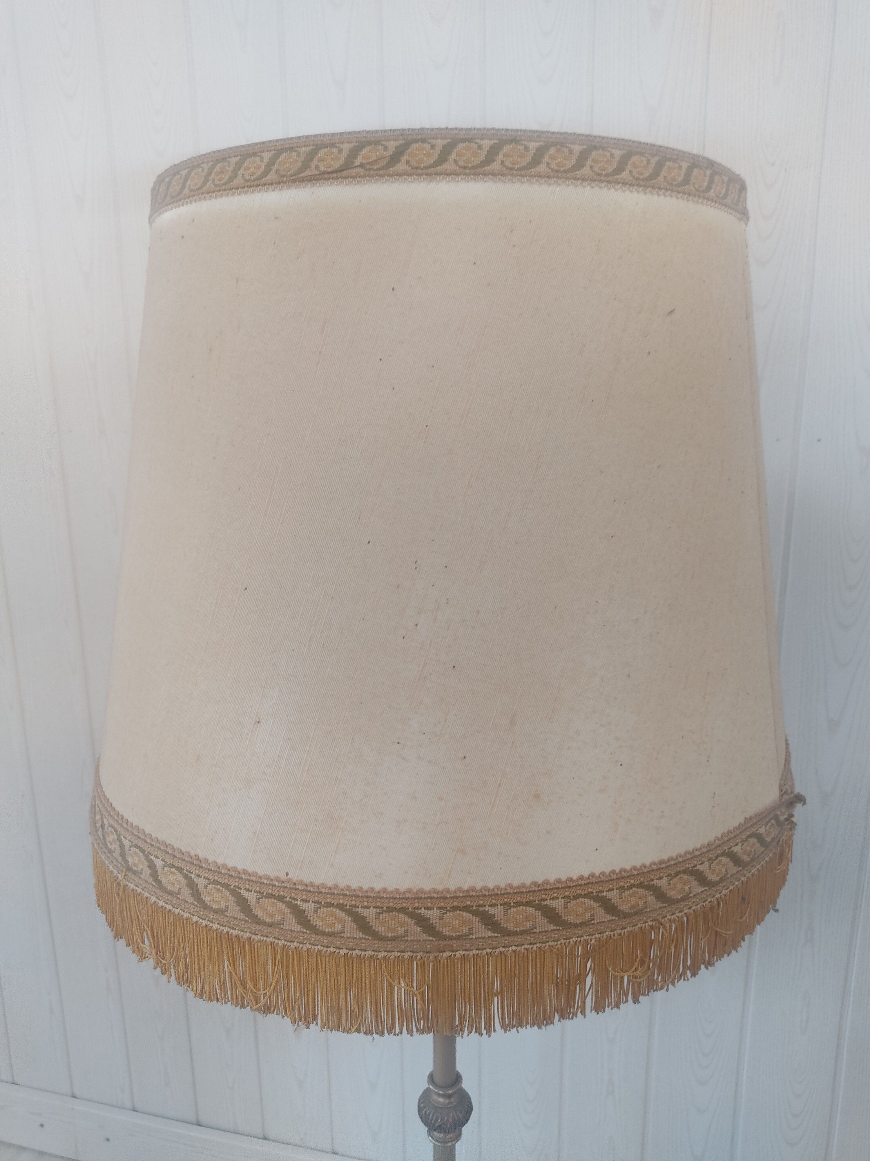 Gilded metal tripod floor lamp