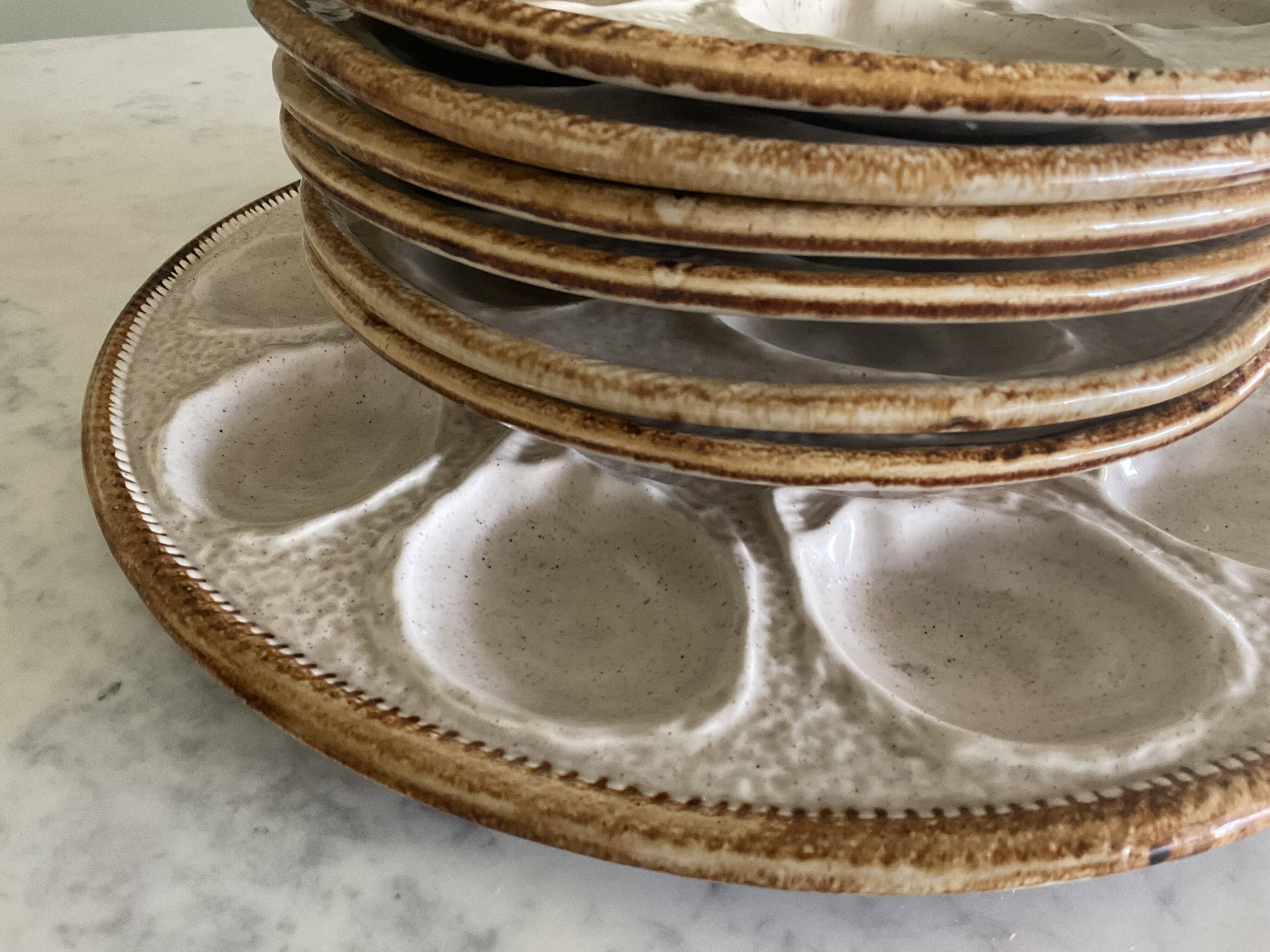 Set of 6 plates and 1 large oyster dish. Saint Clément.