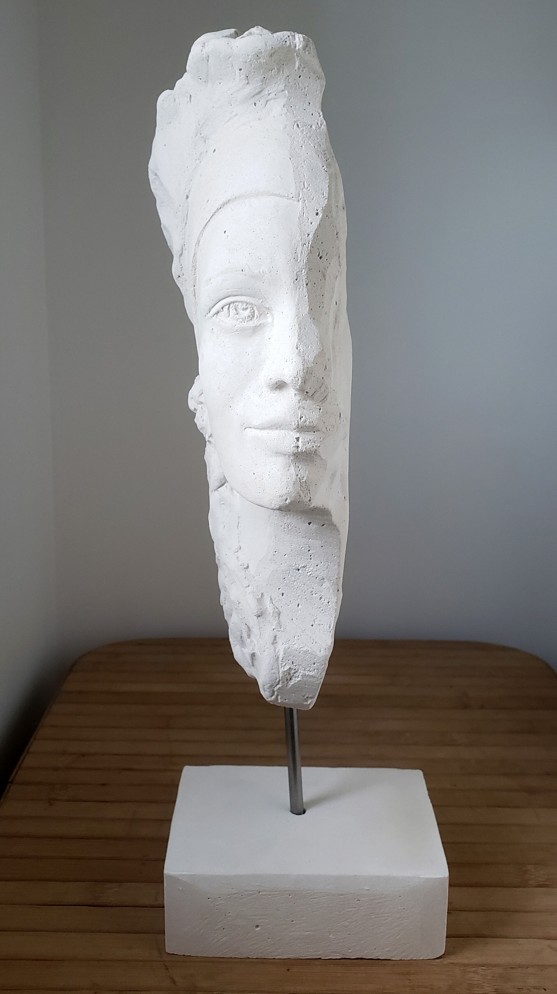 Young woman's head in plaster