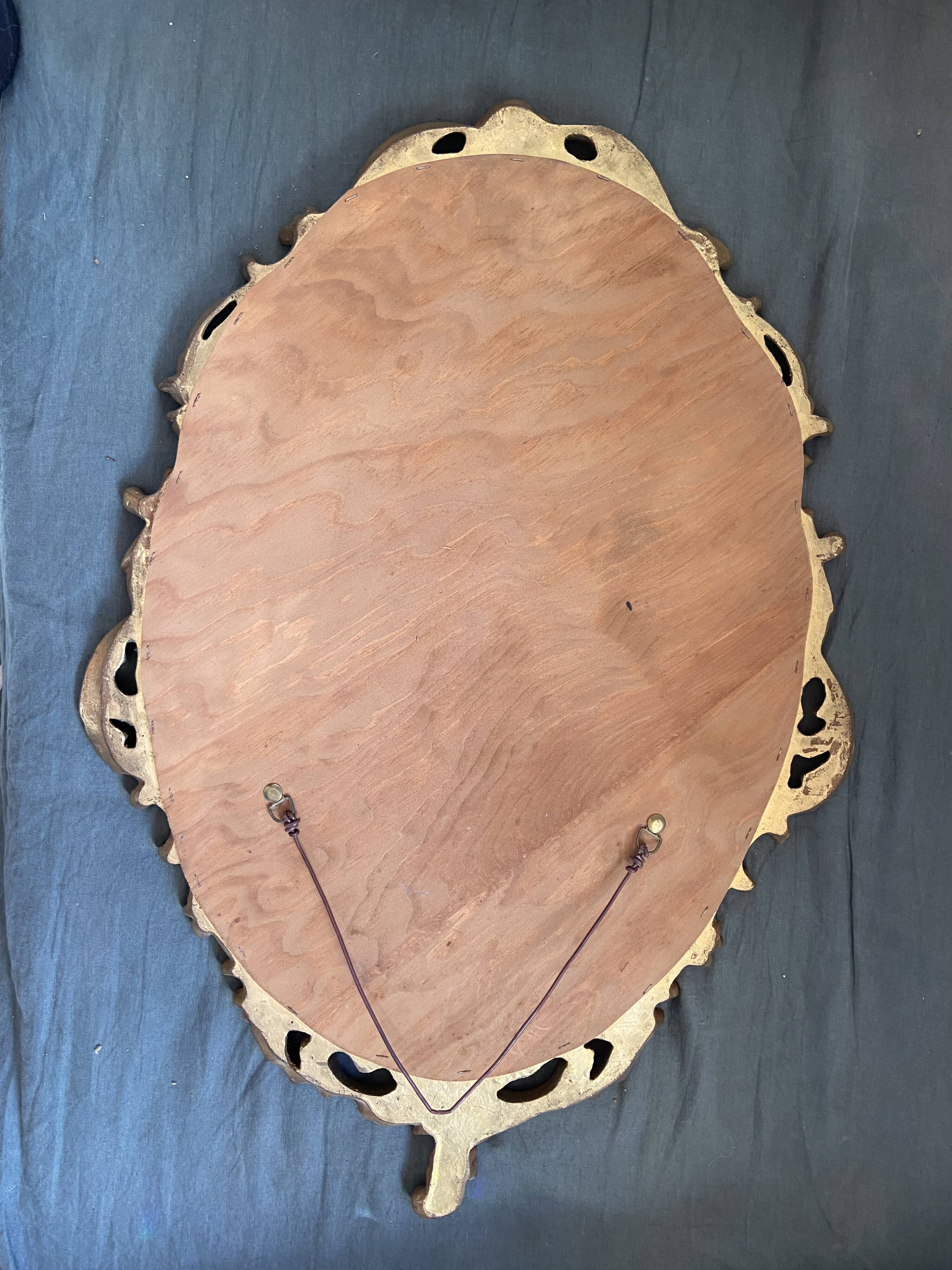 Beautiful Baroque Style Oval Decorative Mirror - Gilded with gold leaf with a Beautiful Patina