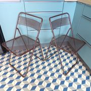 Paire de chaises pliantes en tôle perforée