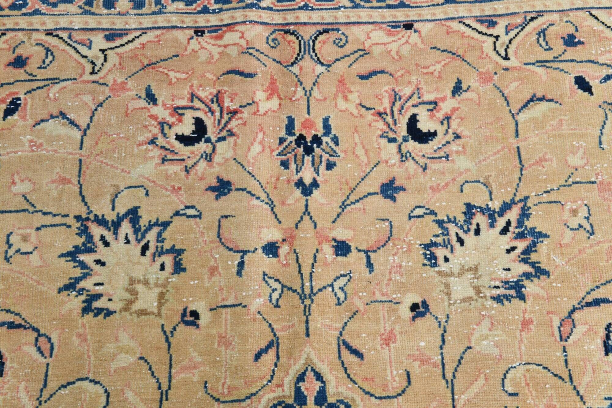 Antique Turkish wool rug in faded floral patterns, 10 x 13 feet.