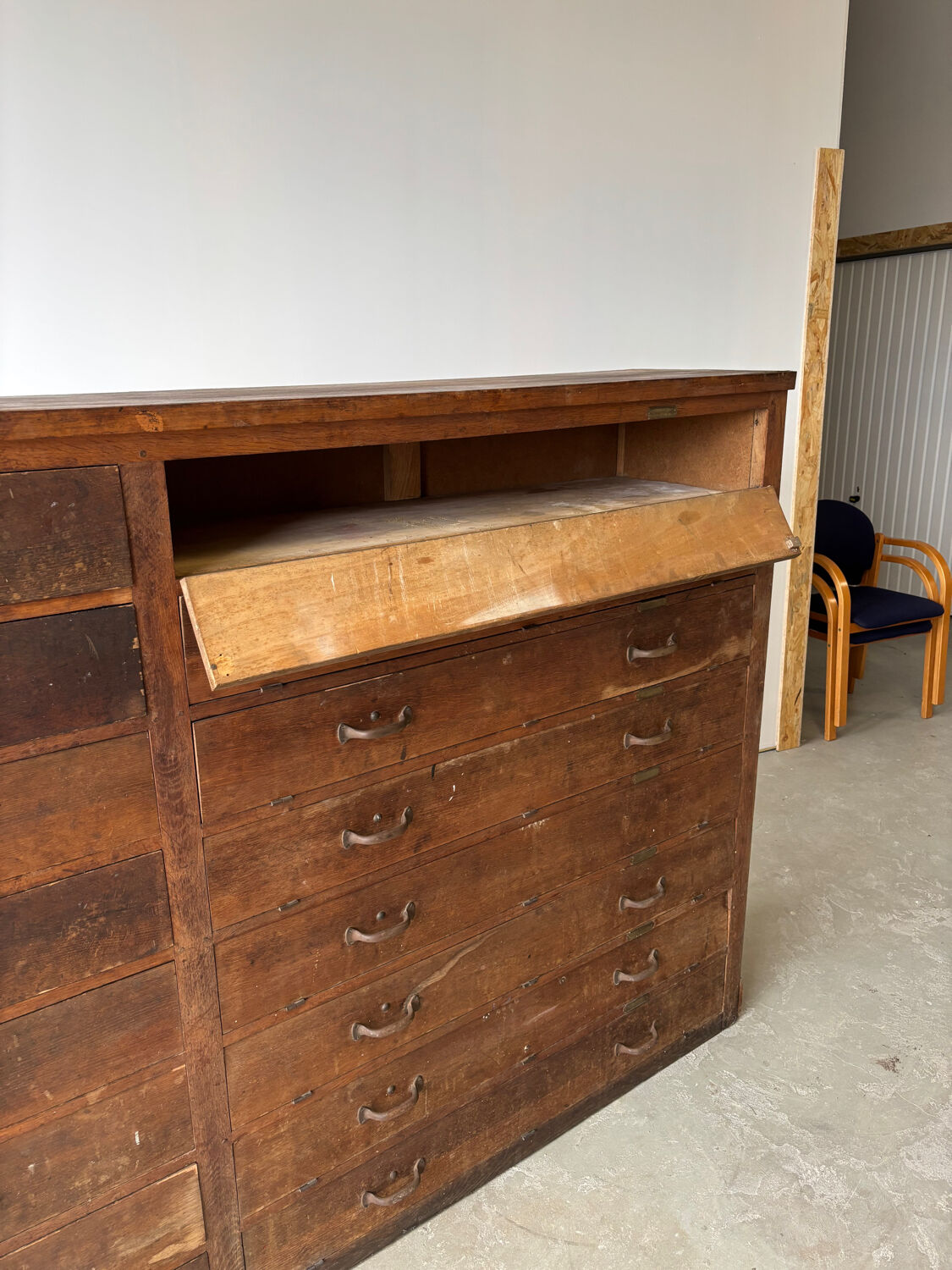 Large wooden workshop cabinet with 16 drawers, antique from the early 1900s.