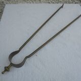 Old brass log clamp for fireplace