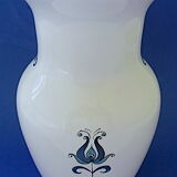 White-blue earthenware vase with stylized plant decoration