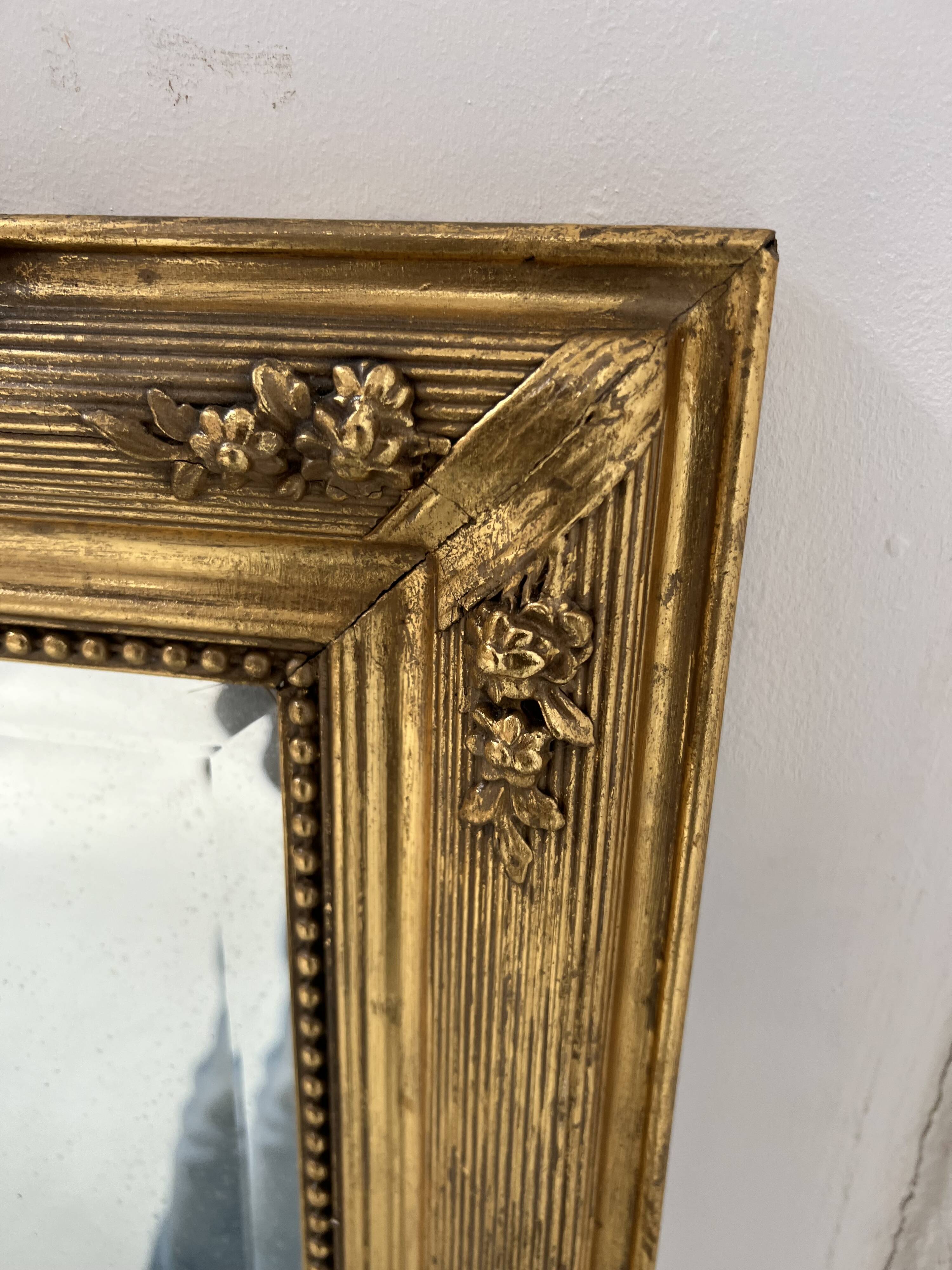 Louis XVI style mirror in wood and gilded stucco, 19th century