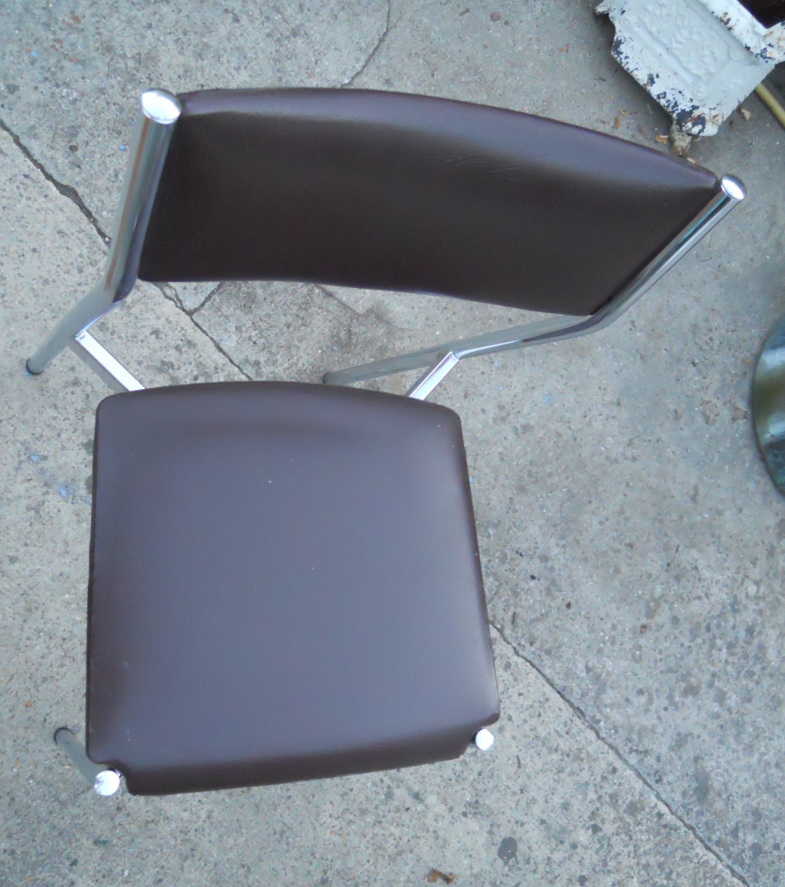Vintage chrome metal chair and faux black leather