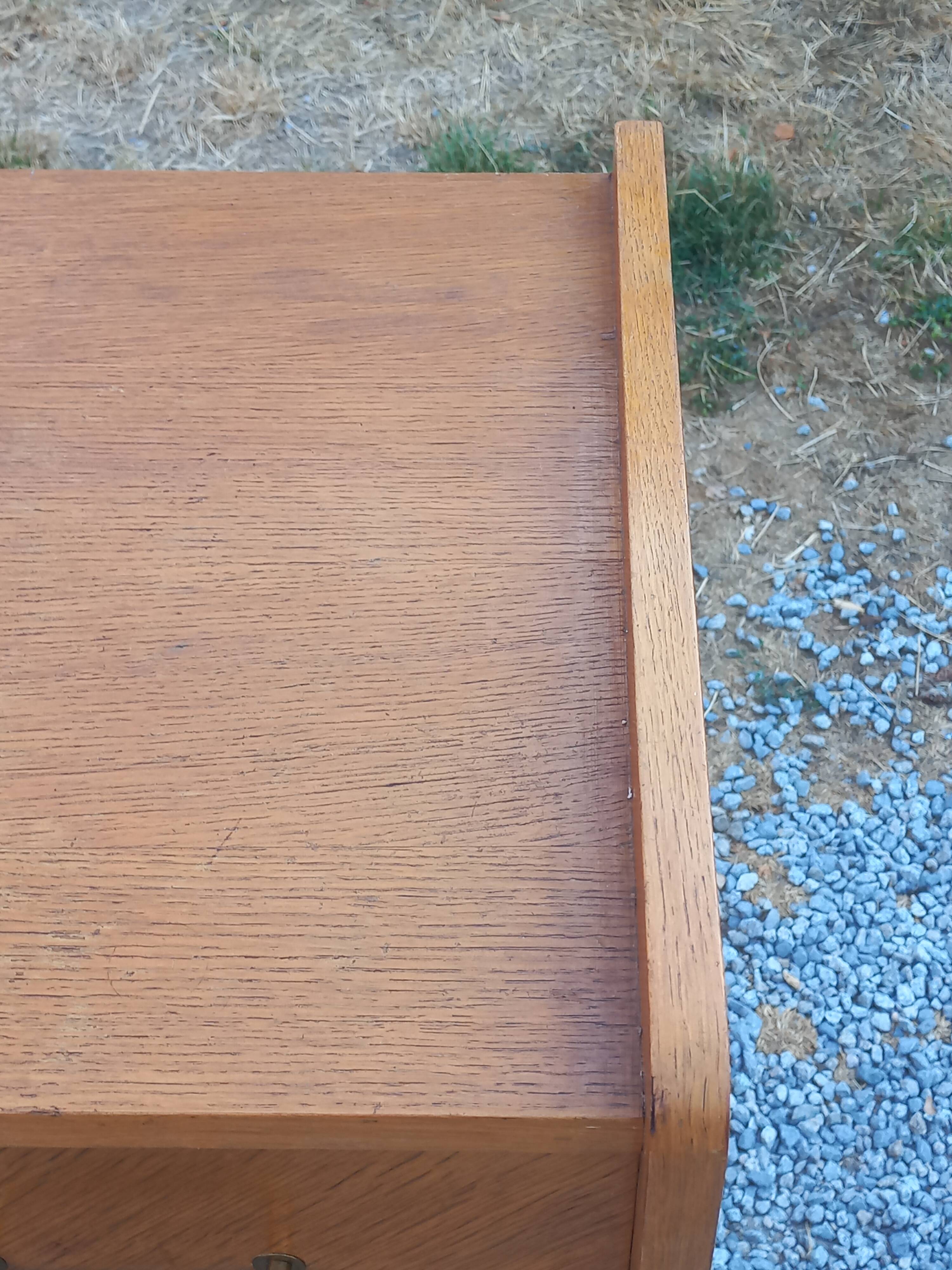 Commode vintage en chêne blond pieds compas 4 tiroirs 1950