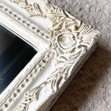 Beveled mirror in carved wood