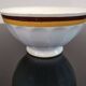 Authentic Vintage ceramic faceted bowl decorated with a double border