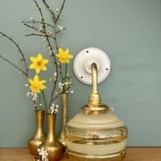 Applique coudée globe vintage en verre jaune et doré
