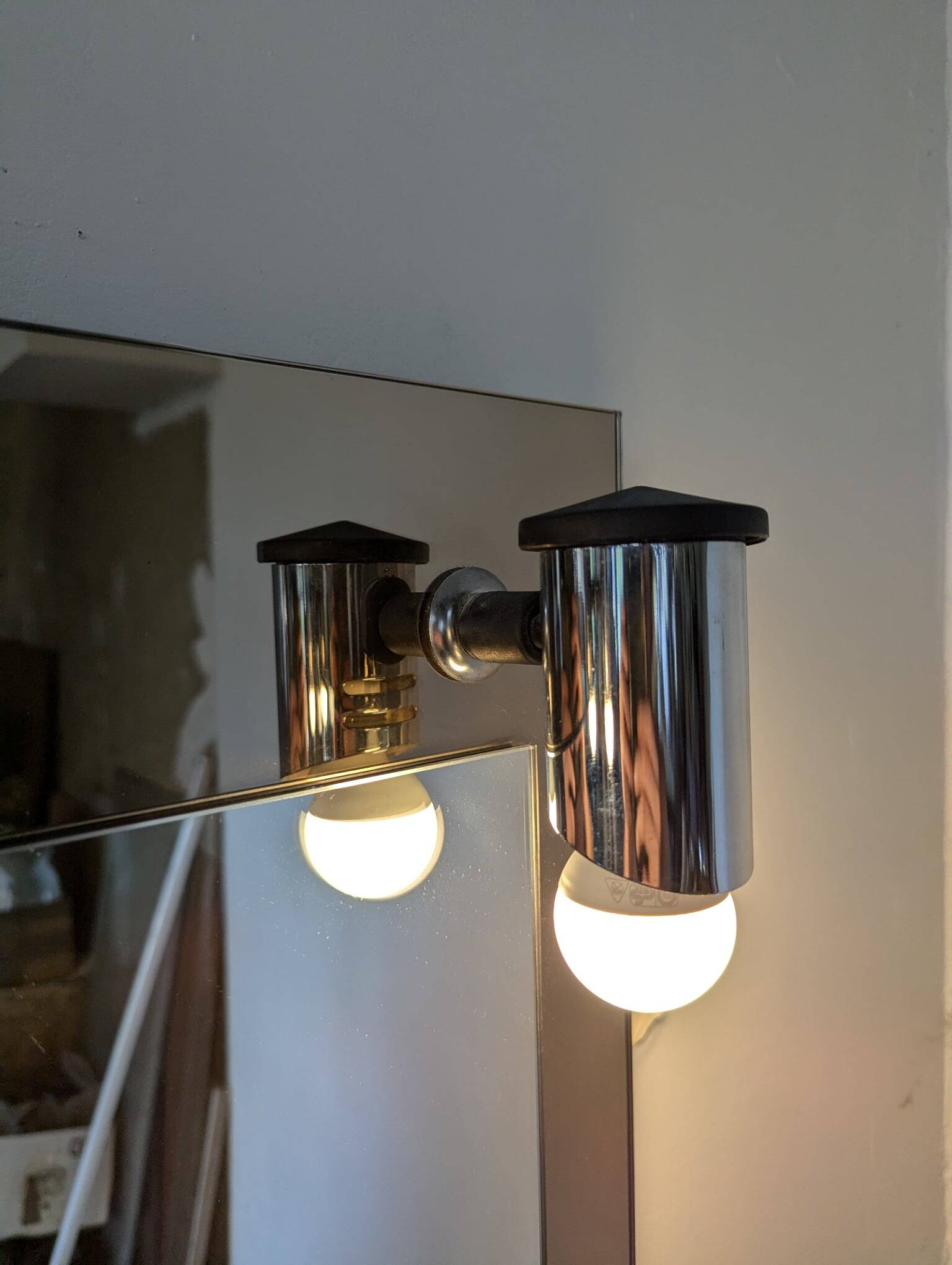 Vintage mirror with sconces.