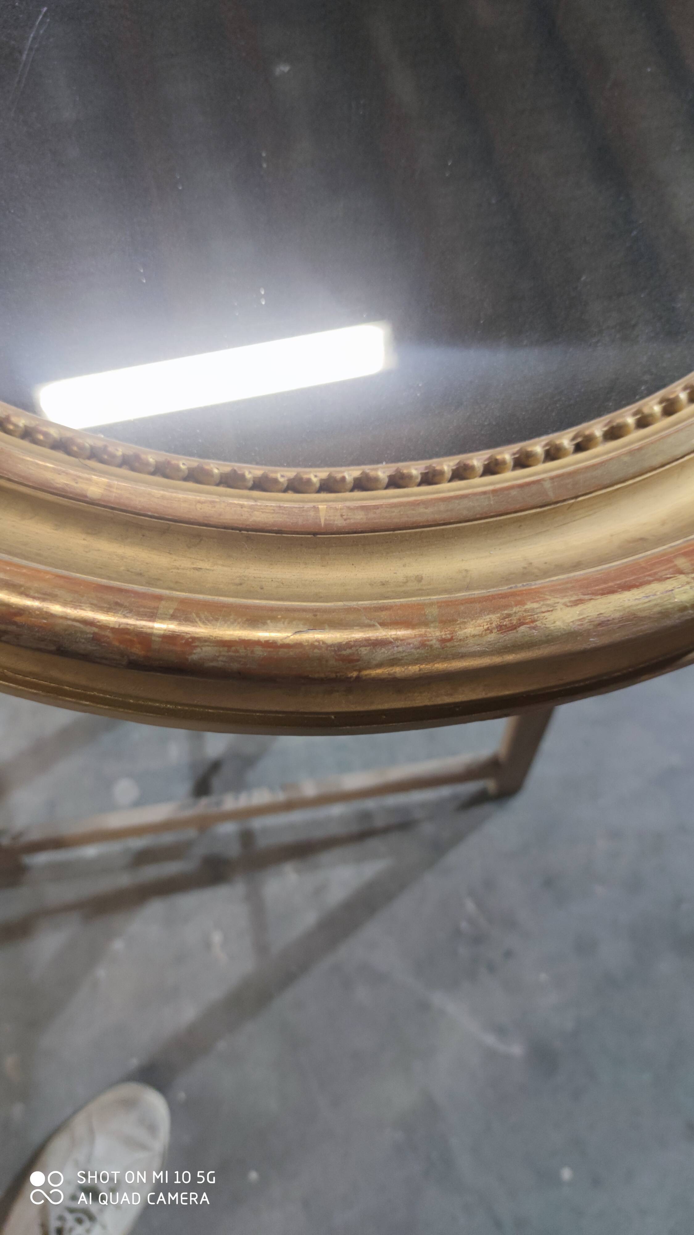 Mirror with a gilt medallion pediment, 1840