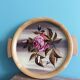Round Art Deco plate, painted decoration signed, roses