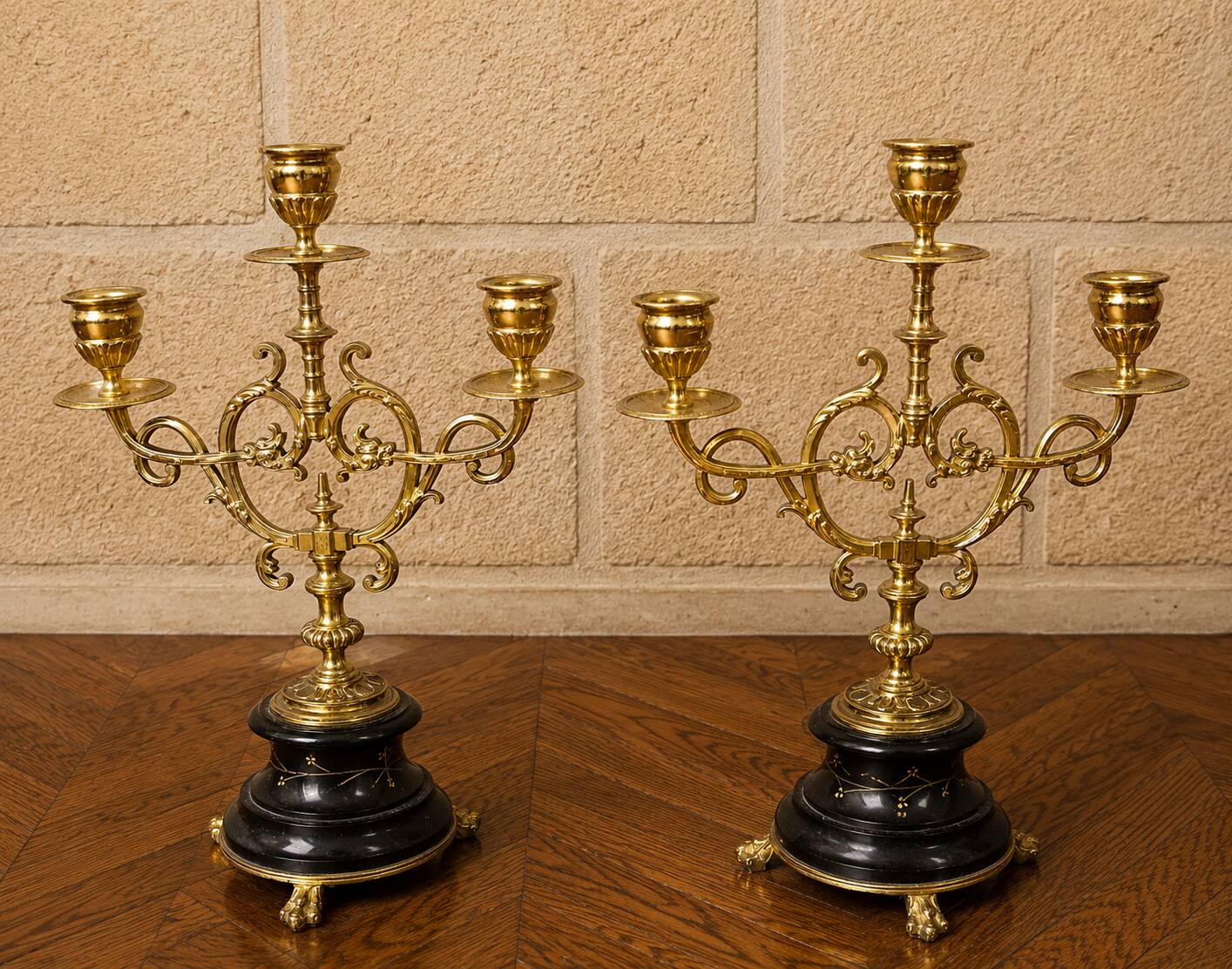 Elegant pair of three-light candelabra in gilded bronze.