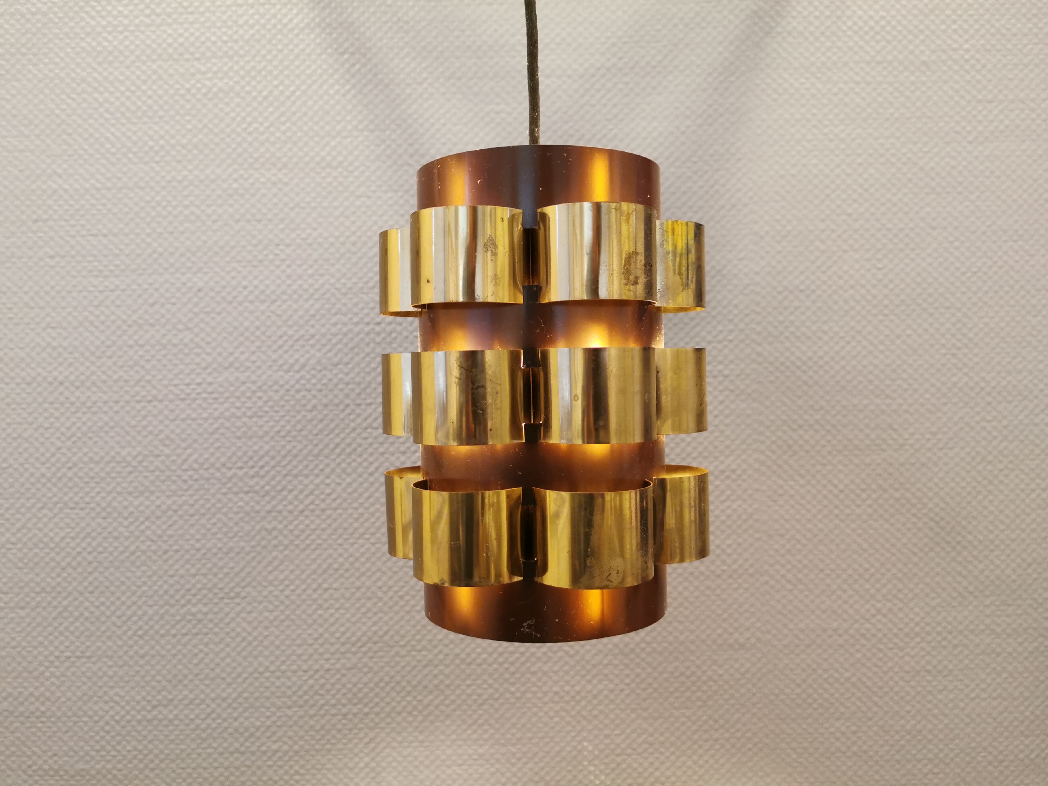 Danish hanging lamp from the 70s, in thin cut metal.