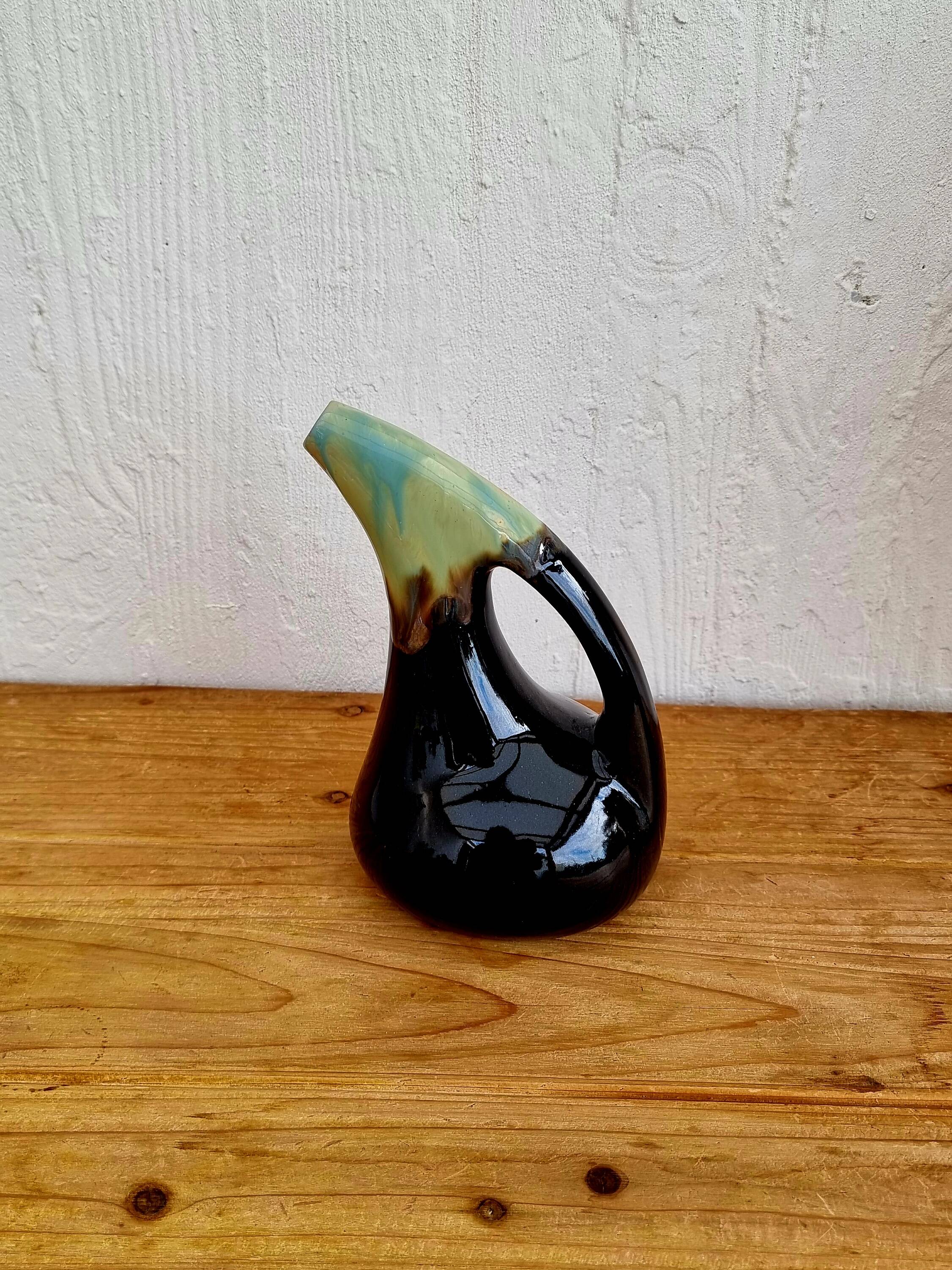 Vintage blue and black ceramic pitcher