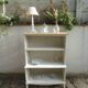 Vintage library enhanced in beige, wooden top.