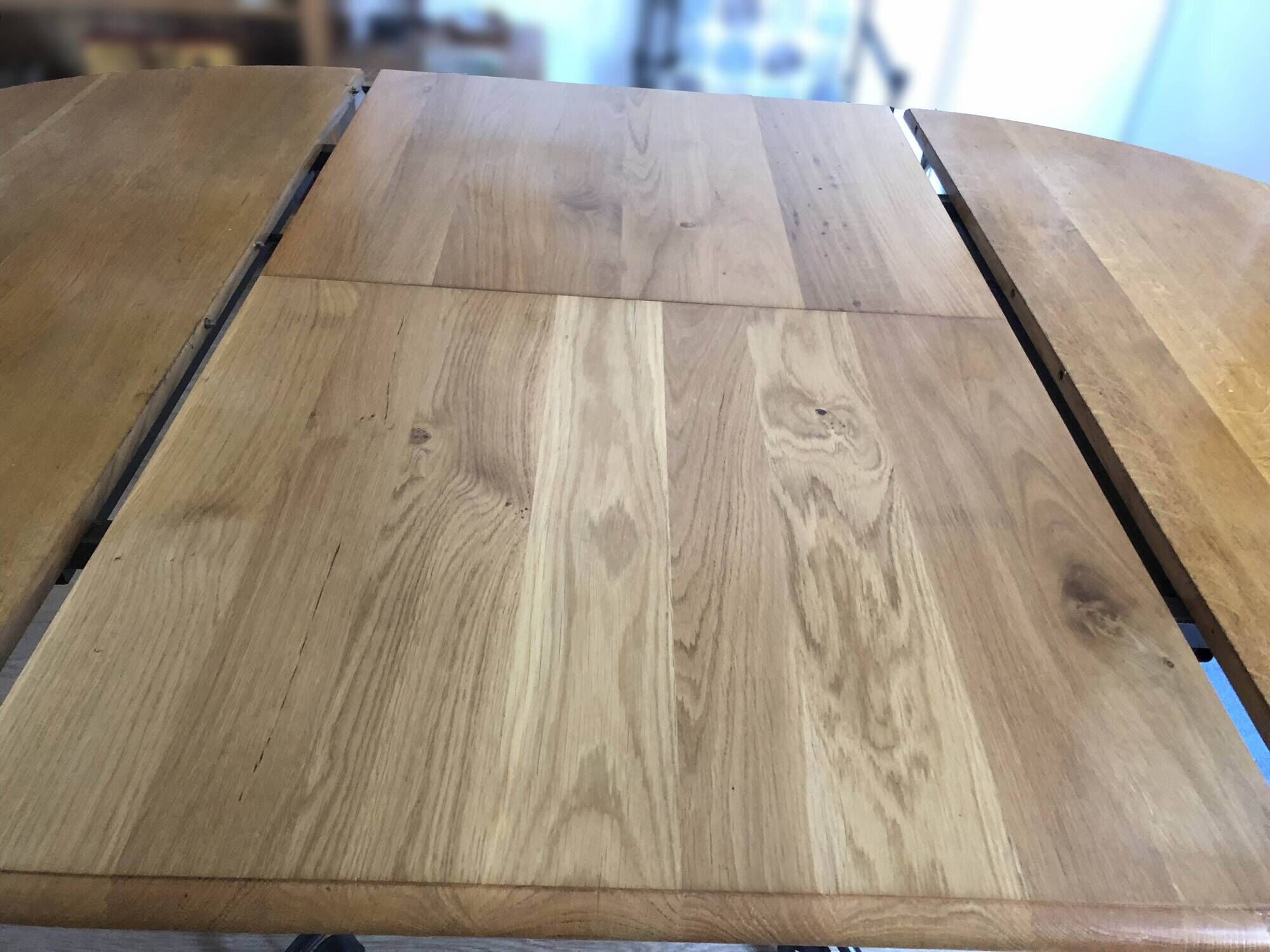 Extendable table in solid oak with wrought iron legs.