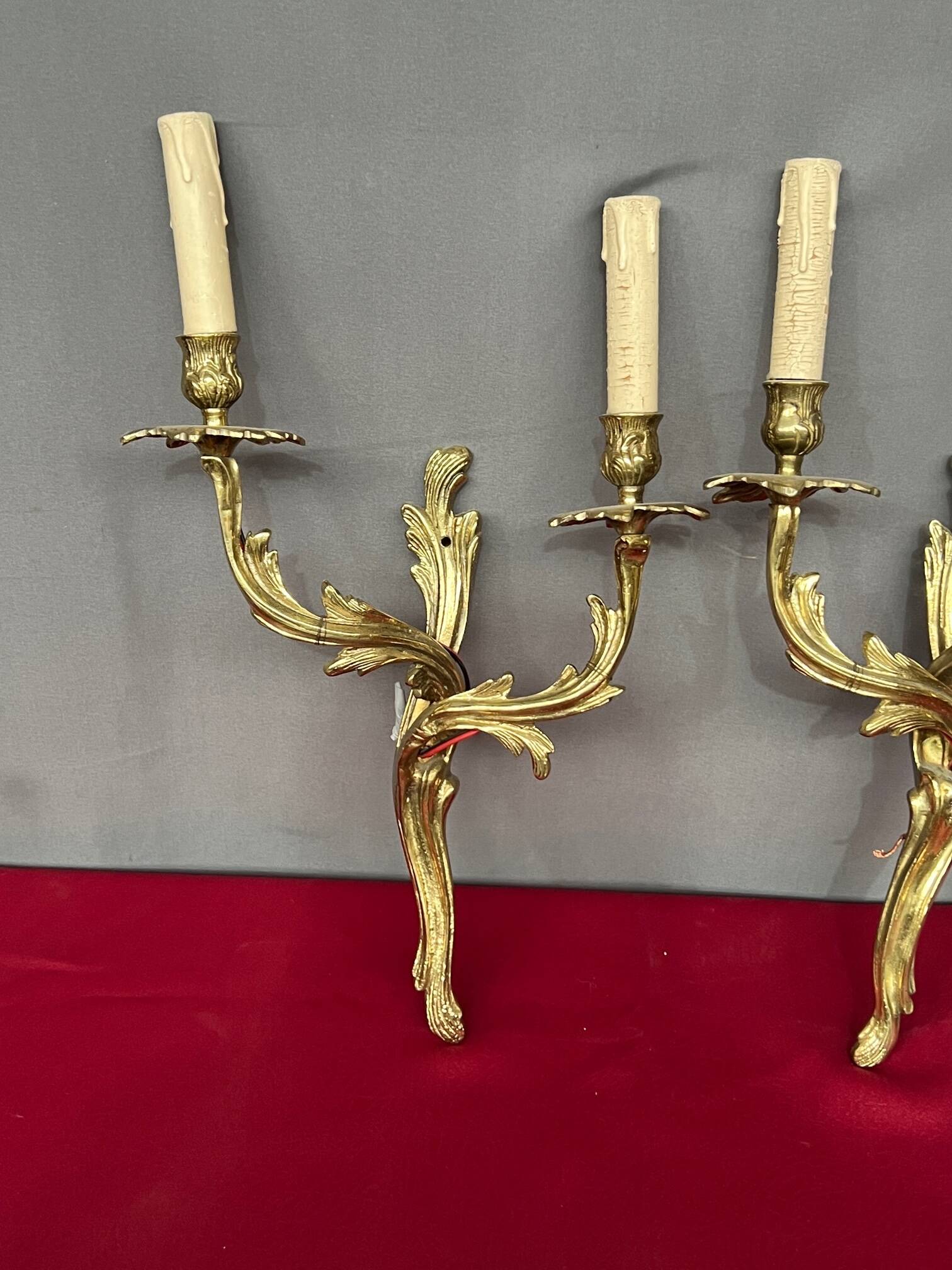 Pair of solid gilded bronze wall lights.