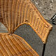 Wicker and black wrought iron armchair