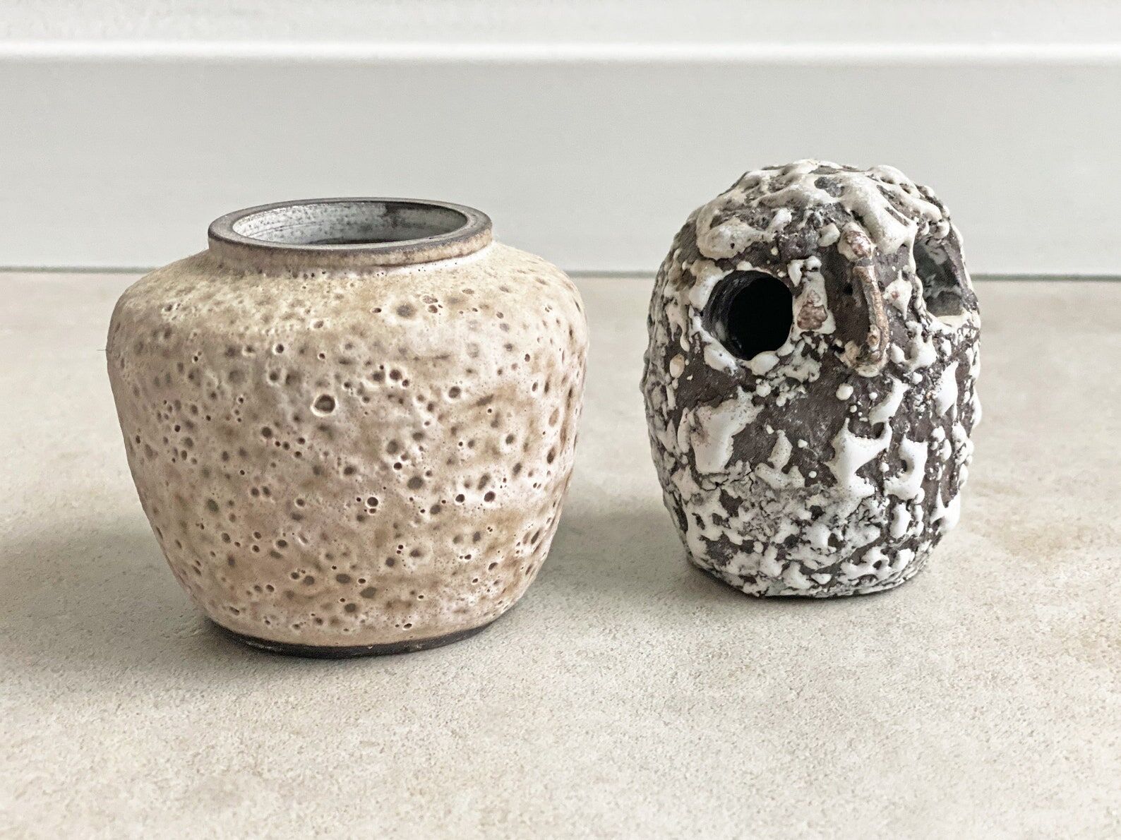 Composition of a small vintage ceramic vase and a ceramic owl figurine / statue