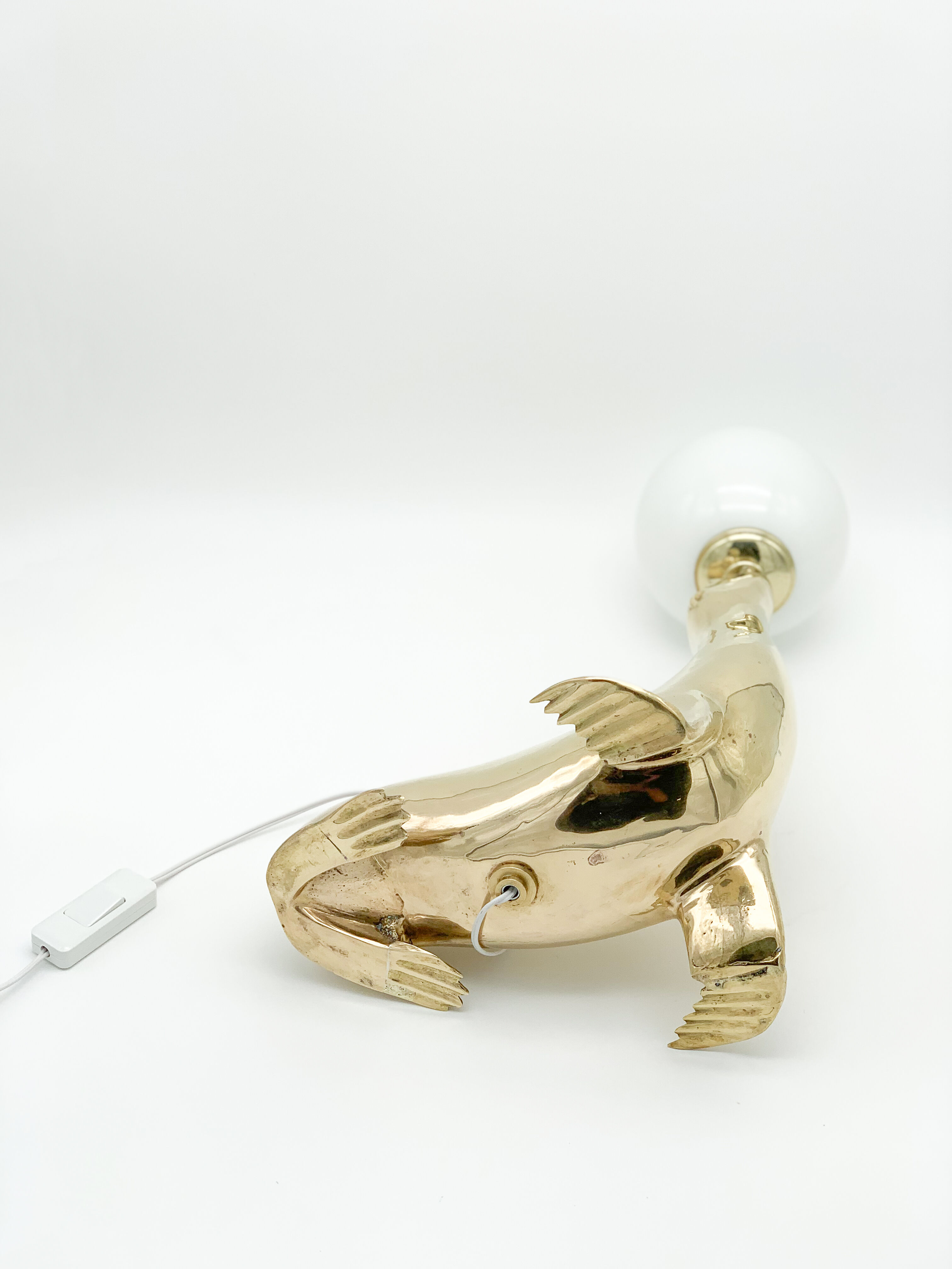 Vintage brass sea lion lamp