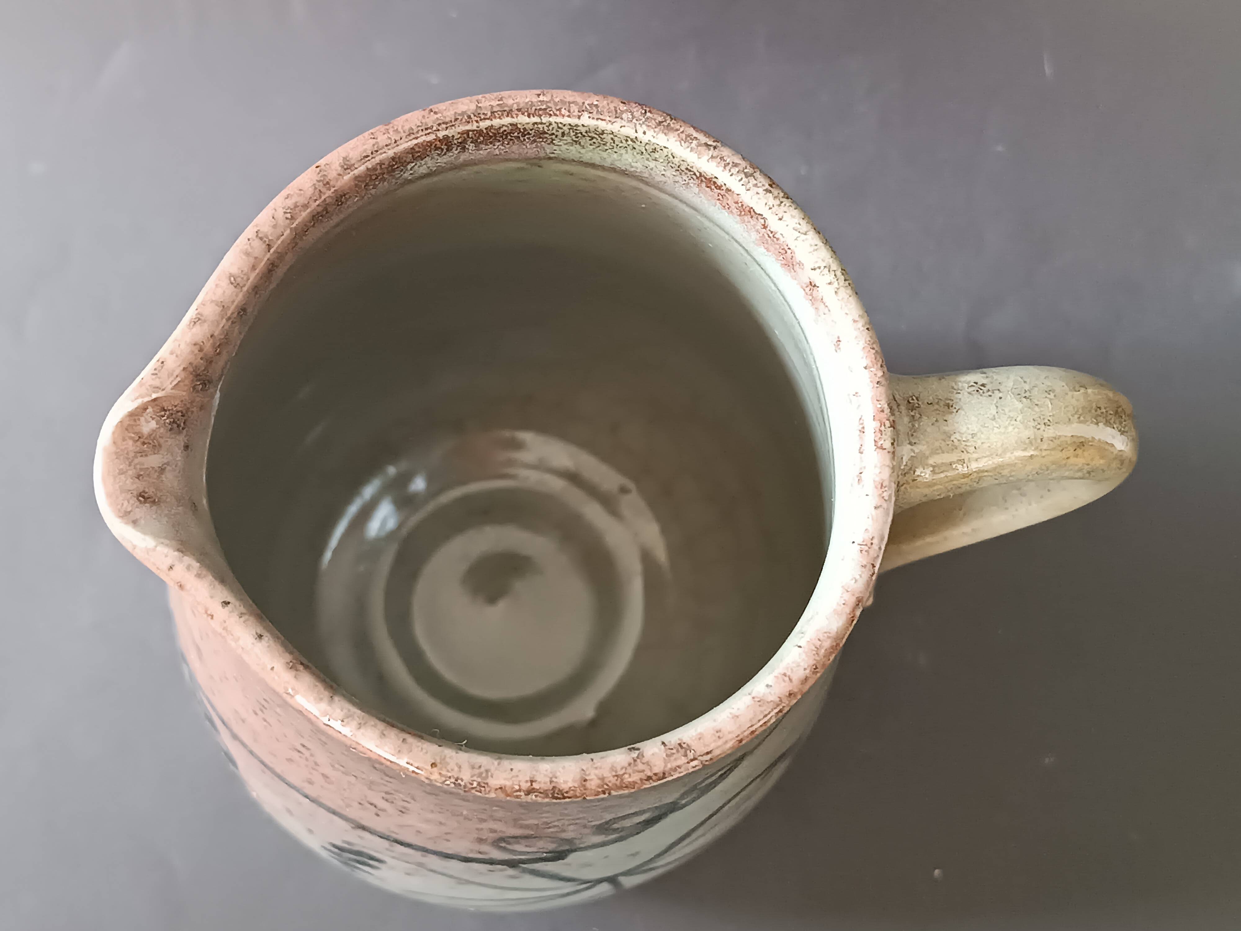 Stoneware pitcher from Alsace, incised decoration of vine by Louis Buecher 1986.