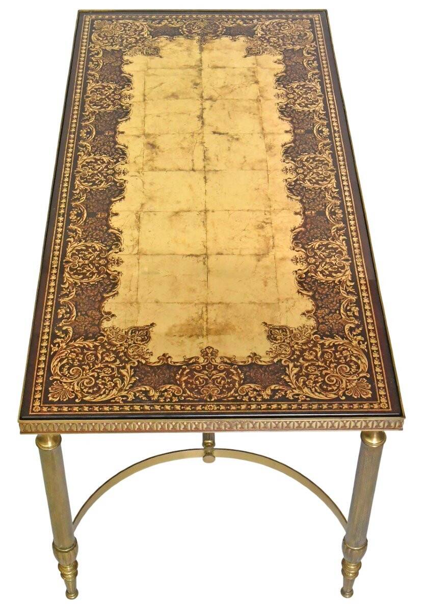 Coffee table in gilded brass with a mirrored eglomisé glass top.