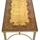 Coffee table in gilded brass with a mirrored eglomisé glass top.