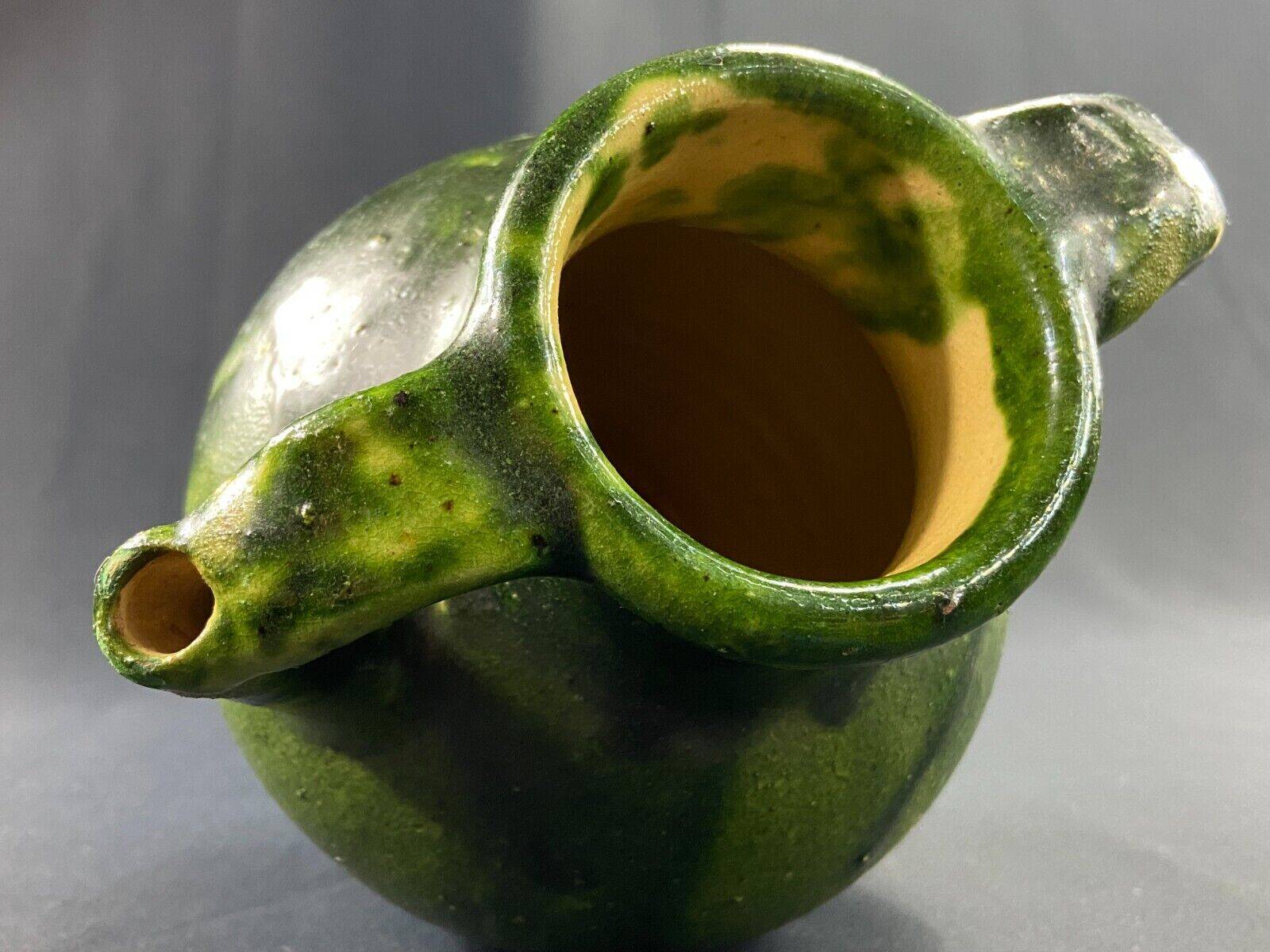 19th century green enamelled stoneware jug