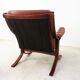 Fauteuil scandinave en bois et cuir cognac