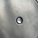 Three-tiered serving trolley in shiny stainless steel.