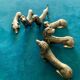 12 old dog-shaped Etains du Manoir knife holders