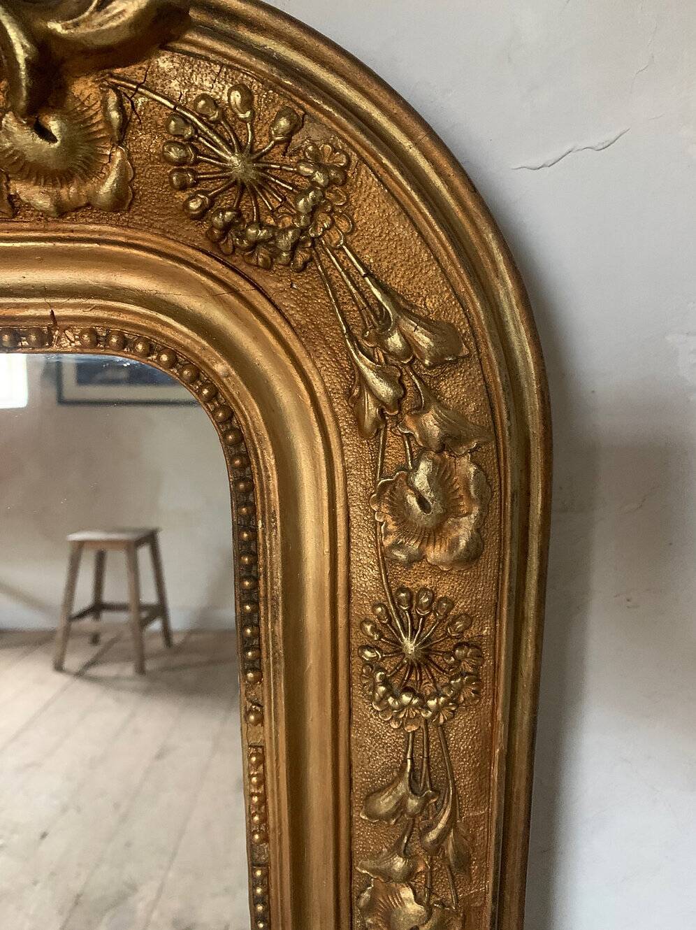 Gilded fireplace mirror with pediment