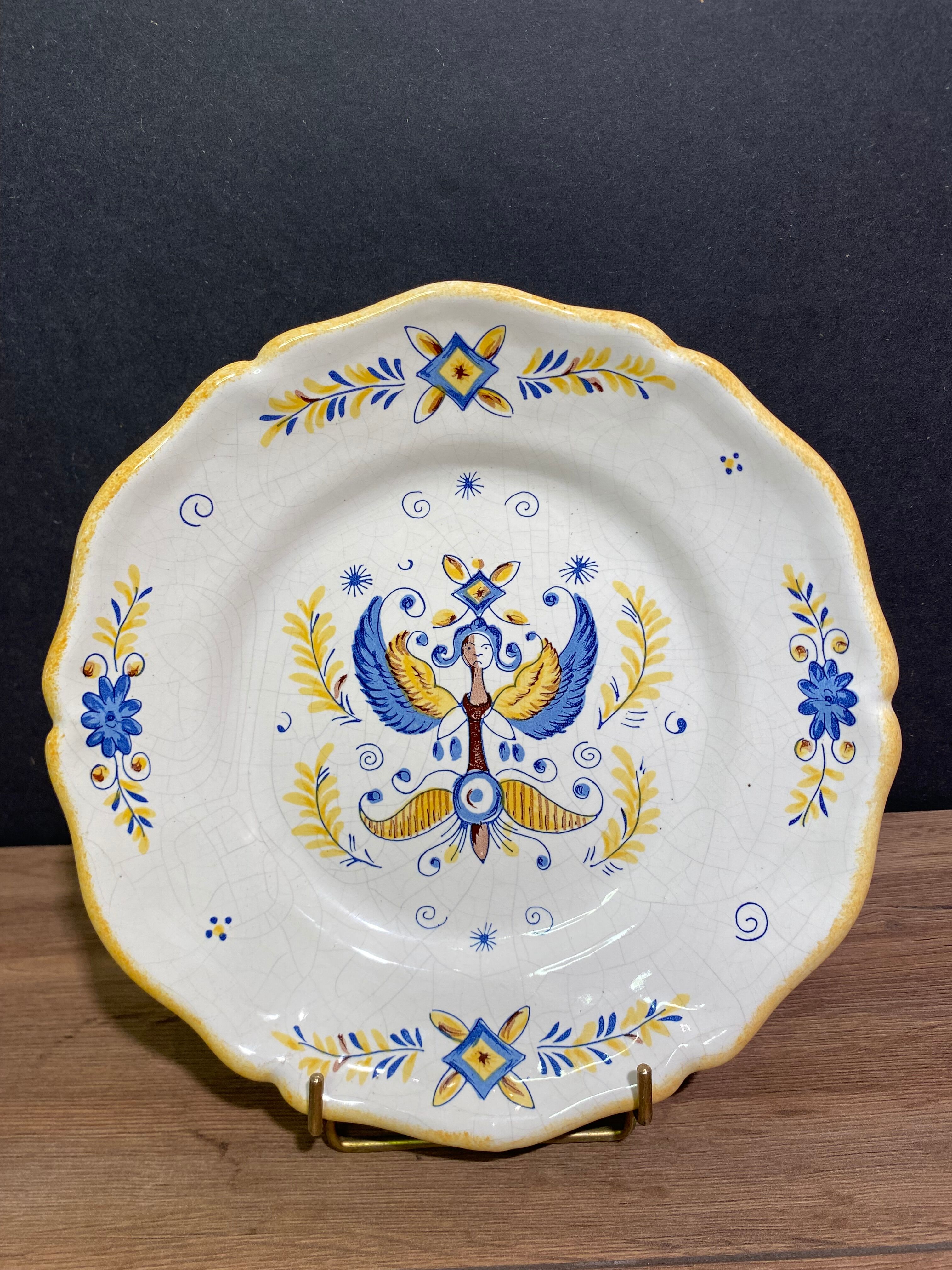 Earthenware plate decorated with winged character decoration in Nevers style, Auxerrois