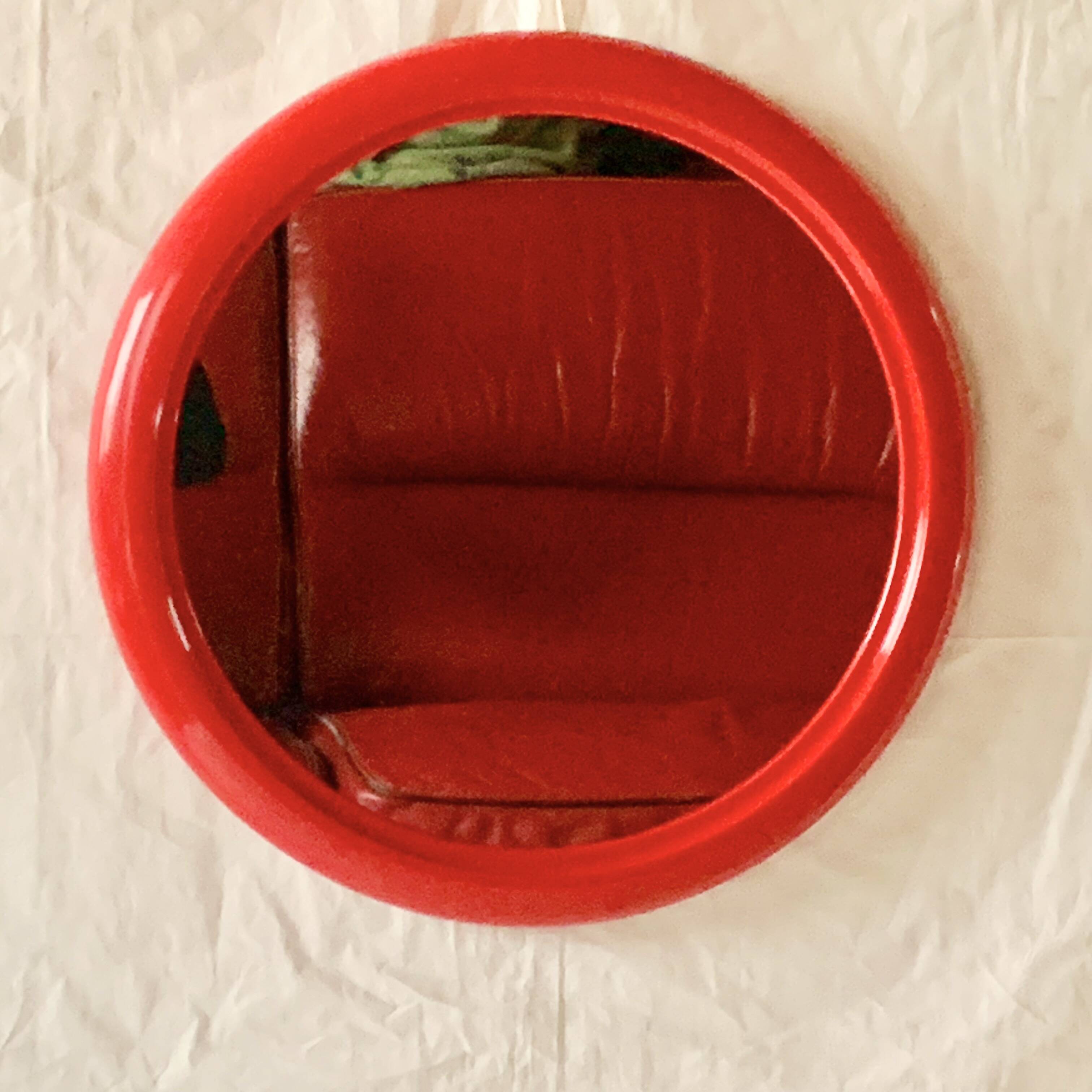 Vintage round red plastic mirror
