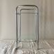 Pedestal table, vintage chrome steel saddle with 2 round windows