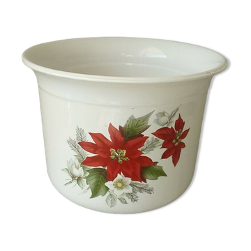 Flower pot in earthenware decorated with Christmas poinsettia flowers.