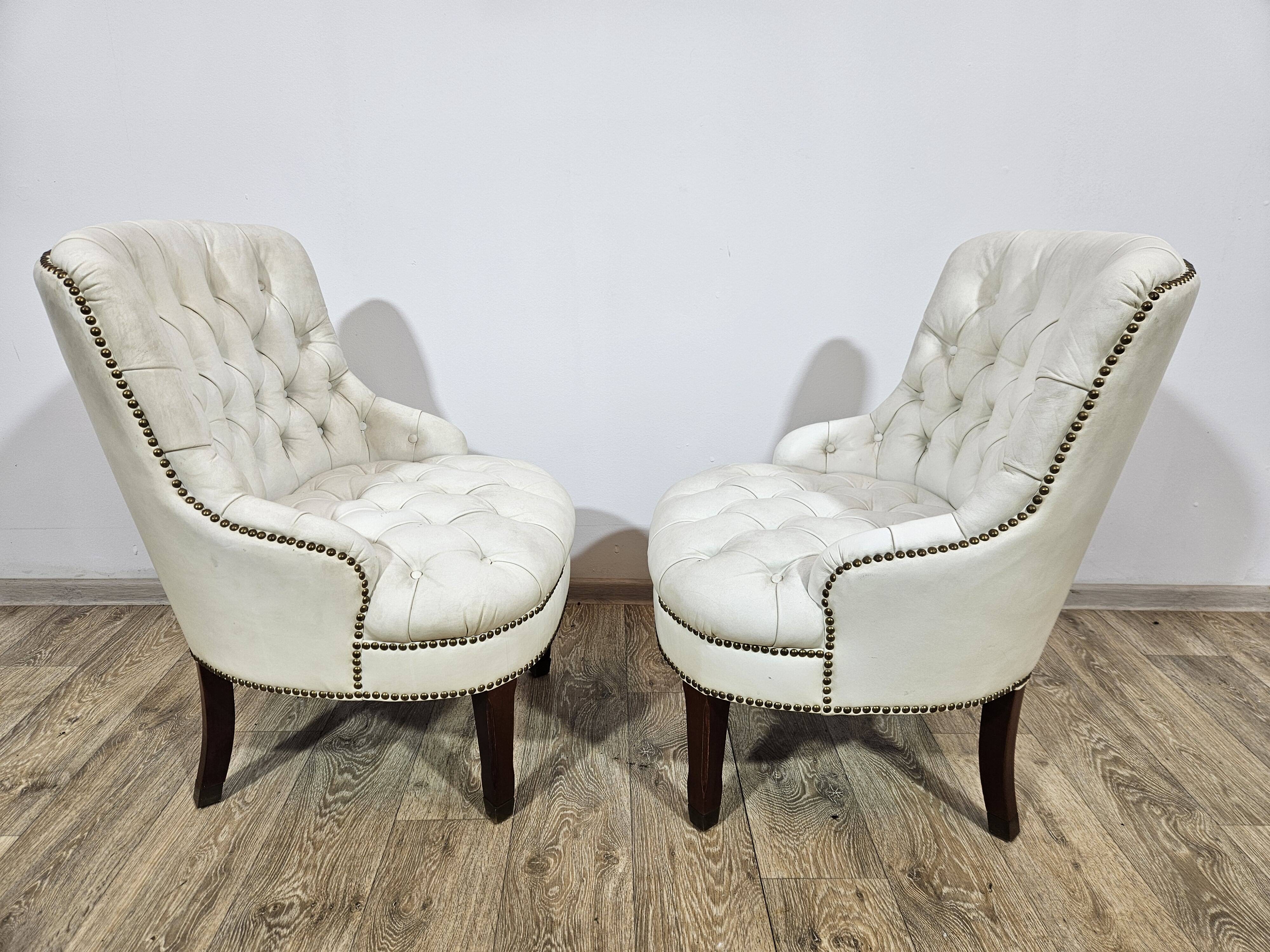 A pair of chesterfield armchairs, England, 1960s