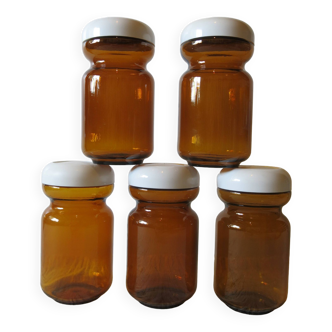 Very pretty set of 5 amber-yellow glass jars with lids