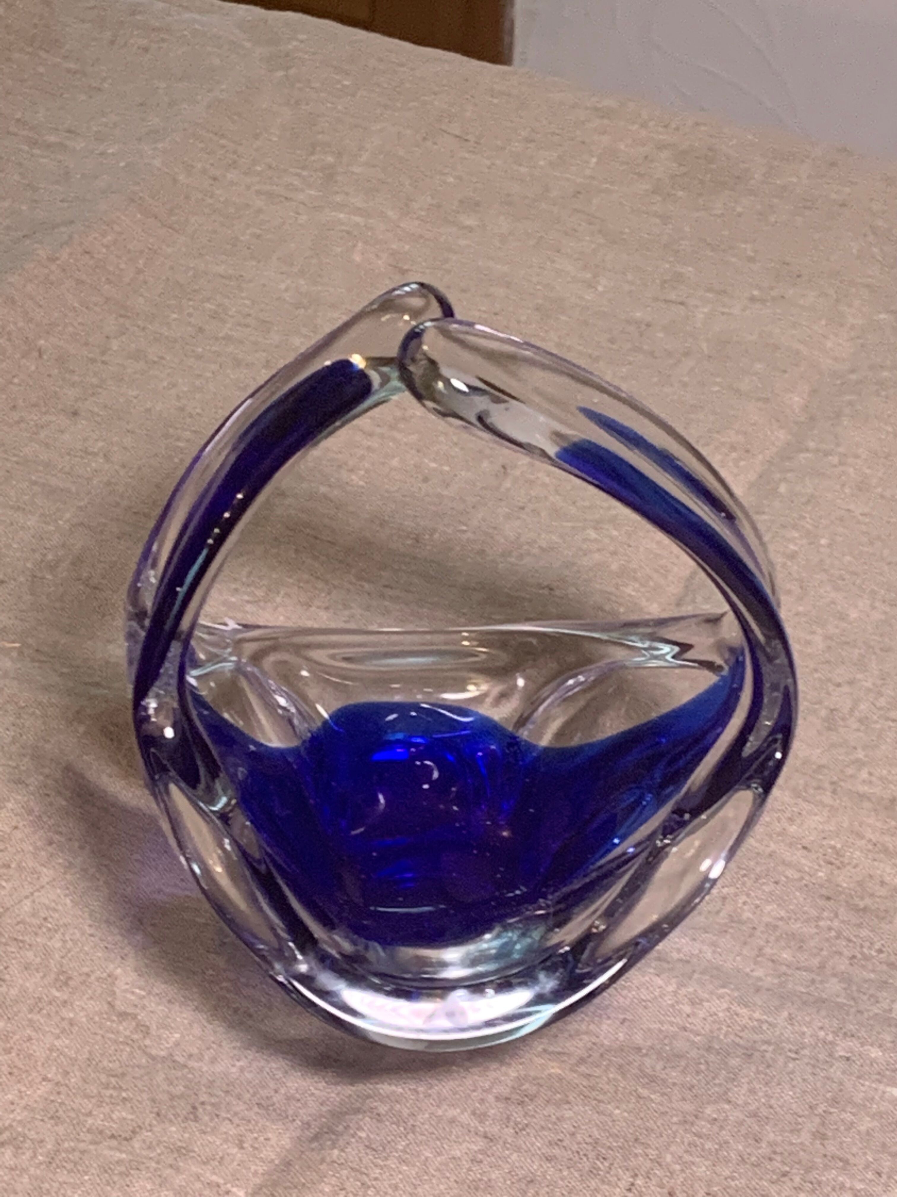 Ashtray in transparent and blue blown glass with a design shape